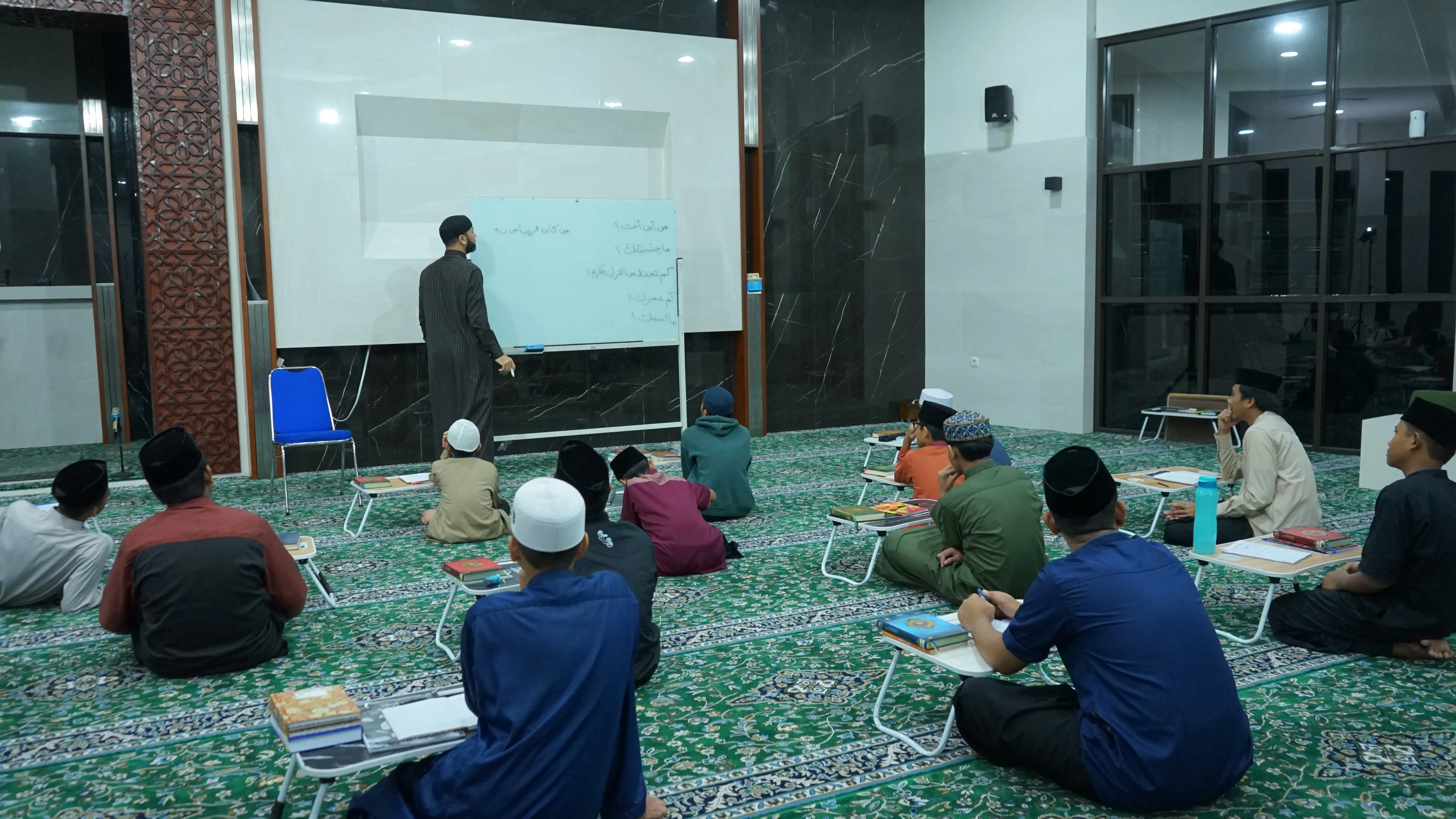Student studying Arabic and Islamic books
